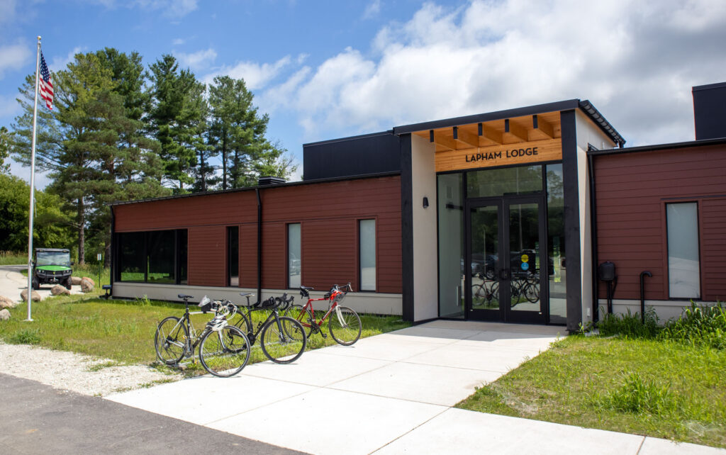The completed Lapham Lodge at Lapham Peak, with bicycles parked outside the main entrance.